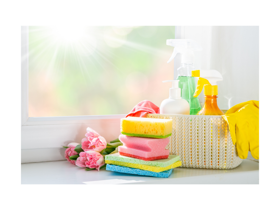 A clean and organized kitchen with sponges and cleaners by Smiley Tot.
