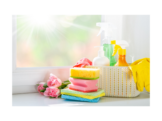A clean and organized kitchen with sponges and cleaners by Smiley Tot.