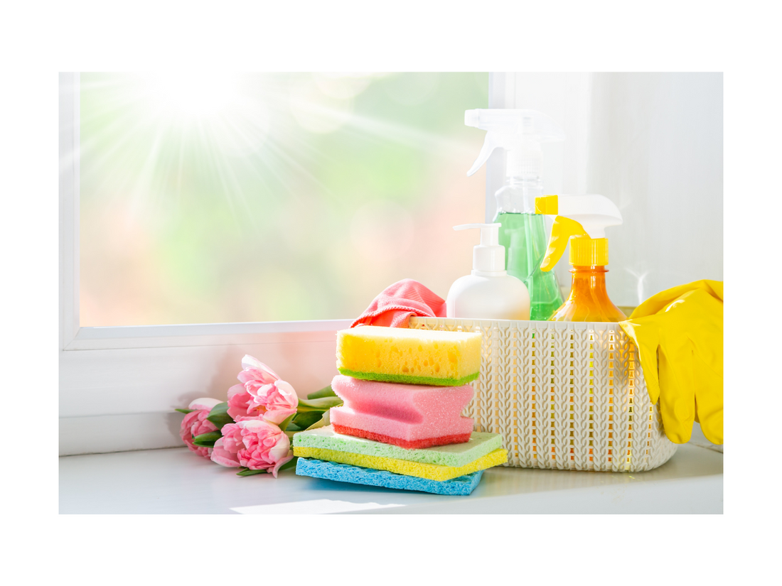 A clean and organized kitchen with sponges and cleaners by Smiley Tot. 