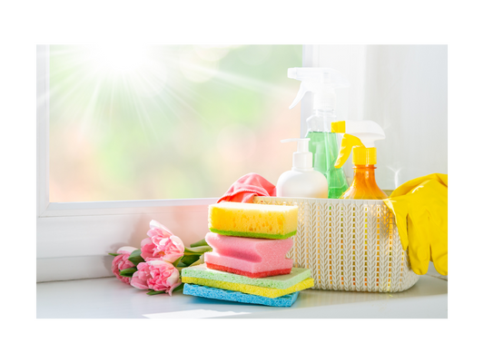 A clean and organized kitchen with sponges and cleaners by Smiley Tot. 